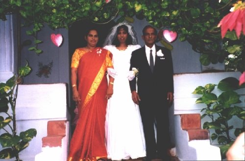 Mom and Dad Leading Maria on her wedding day.