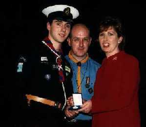 ASSL Cian Timmons Receiving his Gold Award from President McAleese with Scouting Ireland CSI Chief Commissioner Kiernan Gildea.