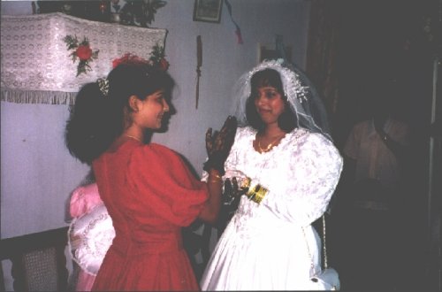 My Youngest Sister Janet giving blessing to Maria on her wedding day.