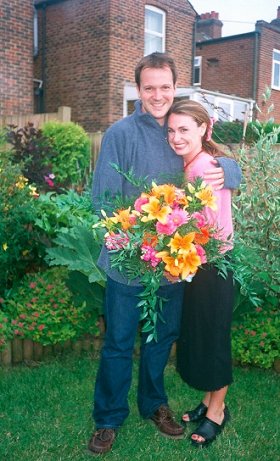 Dan & Vanessa with her wedding day forecourt flowers.
