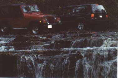 Jeeps on Waterfall