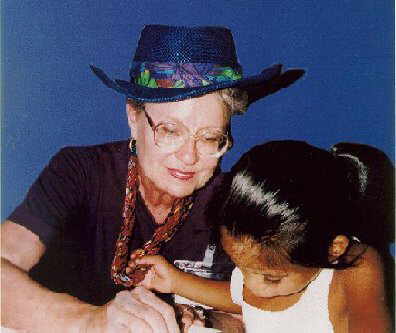 Joanne visiting with a child at an orphanage in Mexico