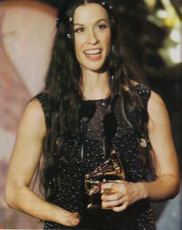 Alanis accepting a Grammy