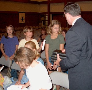 [Cliff Merrill gives Russian Bibles to Children from Chernobyl.]
