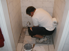 Dad Tiling The Bathroom