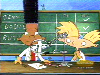 Arnold (Caudell) & Gerald are scientifically analyzing a page taken out of someone's personal book (as it happens, Helga's)... the page has some hair on it (as it happens, Arnold's own)
