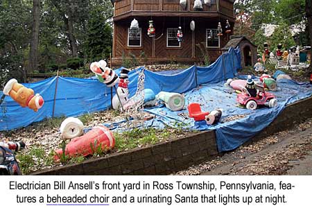 Electrician Bill Ansell's front yard in Ross Township, Pennsylvania, features a beheaded choir and a urinating Santa that lights up at night