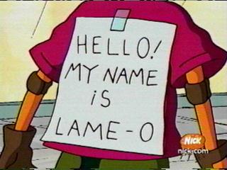 Reggie wearing a sign saying "Hello! My name is Lame-O"