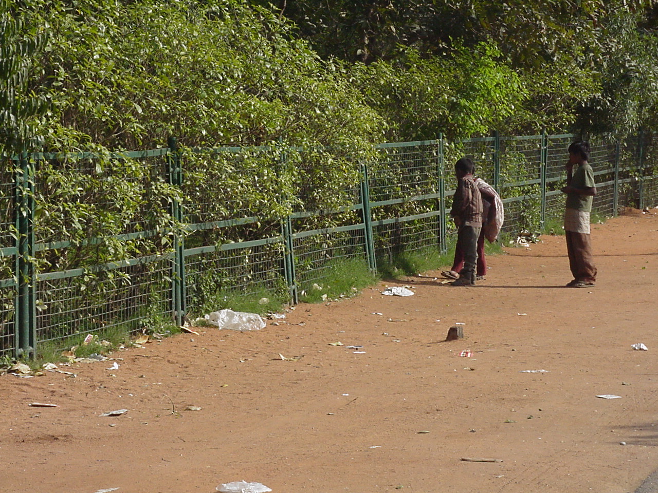 CHILDREN BUSY COLLECTING RAGS AND WASTE PAPER