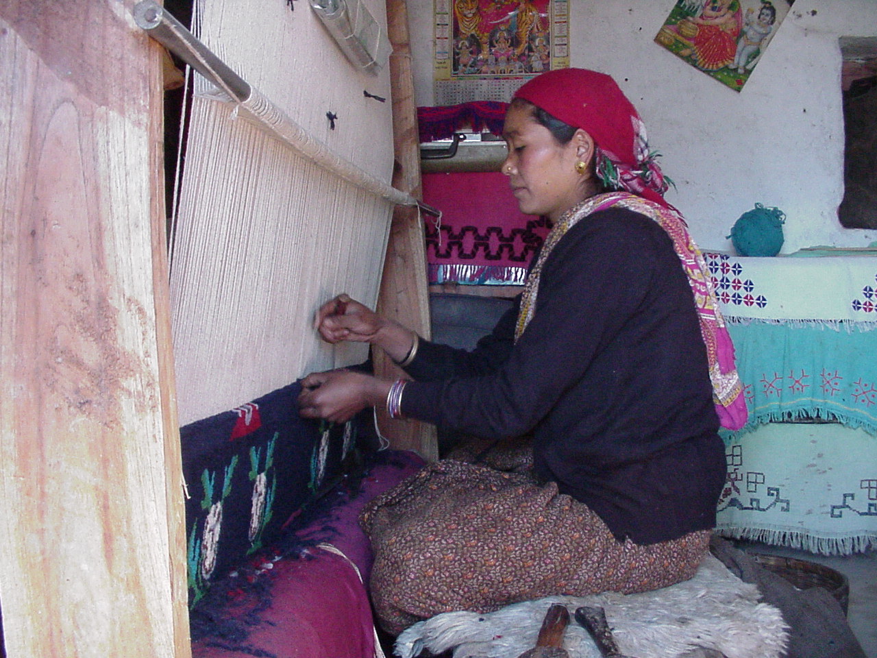 woman weaving carpet
