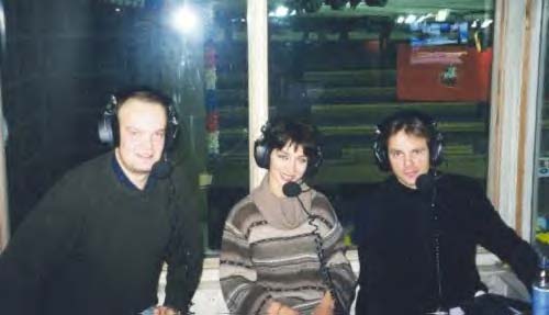 Maya and Evgeny in the TV booth commentating for Russian TV at Russian Nationals