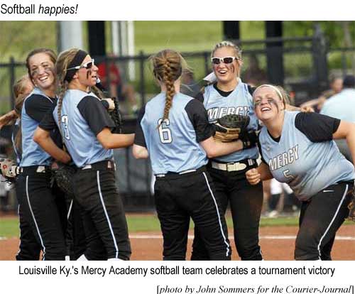 Louisville Ky.'s Mercy Academy softball team celebrates a tournament victory (photo by John Sommeers for Courier-Journal)