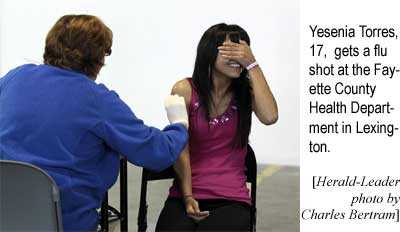 Yesenia Torres, 17, gets a flu shot at the Fayette County Health Center in Lexington (Herald-Leader photo by Charles Bertram)