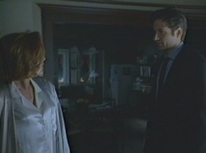 With no consideration for the inappropriateness of the hour, Mulder drags his sorry drunken ass to Scully's door.