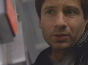 Mulder turns his back on a dangerous killer as he tries to get out of the rigged train car. I guess he forgot how resourceful the Syndicate can be.