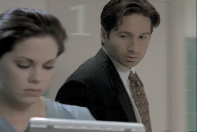 Mulder nearly trips over his own feet while ogling a nurse when he should have been paying attention to what his partner was saying.