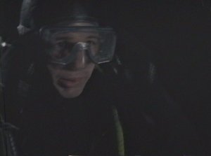 Mulder sheepishly admits that he has no actual scuba diving experience seconds before diving into 50 feet of water.