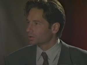 Mulder interrupts Scully to go off on a rant during a Senate committee meeting. Very smooth!