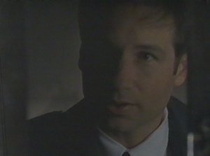 Mulder sticks his foot in Arthur Dales' door to keep him from slamming the door in his face despite the fact that he's not there on official business and has no grounds on which to force his way in.