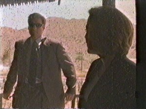 Mulder tries to do his "Joe Cool" impression at the farmer's door. He ends up looking more like "Joe Doofus"