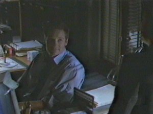 Mulder eats his heart out after doing some breaking and entering into Kersh's computer.