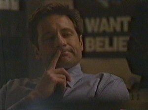 Mulder plays another guessing game instead of merely telling Scully what was so interesting about the case.