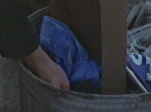 Mulder decides to augment the tresspassing he's about to do with a little dumpster diving.