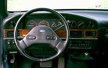 The instrument panel includes a tachometer