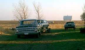 Old Green II my 1969 Ford F100 hooked to a car trailer sitting by my 1986 Chrysler Fifth Avenue