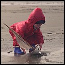 Andrew with model boat on the beach