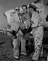 Being hoisted aloft by (fromleft ot right) Benjamin Franklin and Colonel John Spatz immediately after setting world speed record for 100km closed course in Detroit, Michigan, August 17, 1951. From General Ascani's private collection