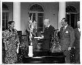 Picture 2 of Jackie Cochran and Chuck Yeager being presented with the Harmon International Trophies by President Eisenhower. Courtesay AFFTC History Office