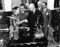 Picture 3 of Jackie Cochran and Chuck Yeager being presented with the Harmon International Trophies by President Eisenhower. Courtesay AFFTC History Office