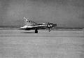 Early shot of bare metal XF-92A touching down on Rogers Dry Lake