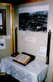 Fra 125-års jubileet i 1992 - utstilling bak i kirken - gamle elektriske alterlys     
The old electric candles from the altar.