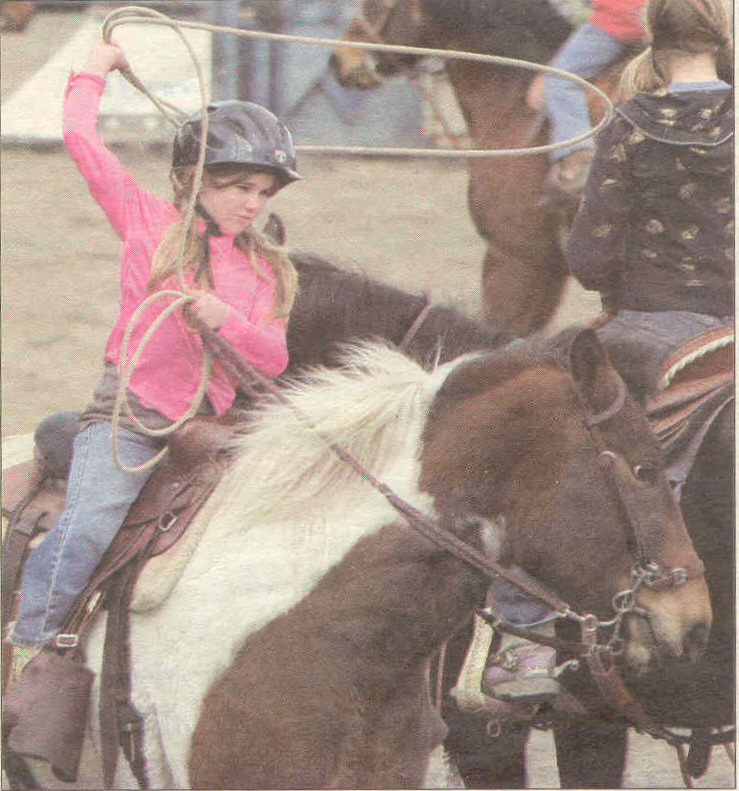 Here, Jasmine (9) seriously practices her roping technique before entering the next competition.