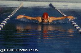 Female swimmer in pool doing butterfly