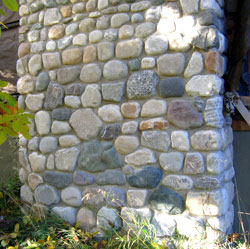 Close up picture of the stone chimney on the left.