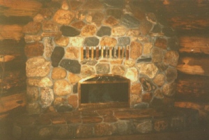 Photo of a natural stone fireplace.