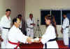 Sensei Daisy Ortino being promoted to Shodan