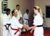 Sensei Stevie Hutchinson being promoted to 2nd Dan