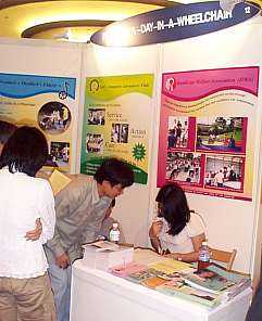 Visitors enquiring at our exhibition booth