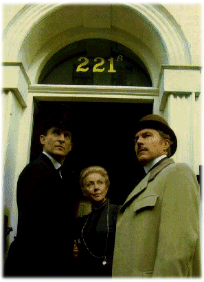 221B Baker Street from outside-Standing from left to right: Sherlock Holmes, Mrs. Hudson, Dr. Watson
