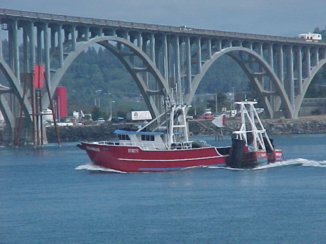 Fishing boat comming into port..Yaquina Bay ,Newport Oregon..