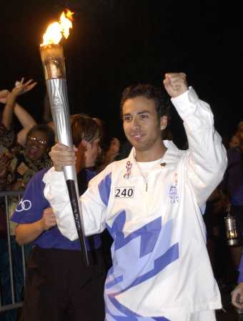 Howie D. of the Backstreet Boys carrying the Olympic Torch in Orlando, FL on December 7, 2001.
