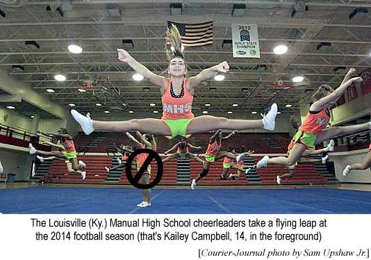 The Louisville (Ky.) Manual High School cheerleaders take a flying leap at the 2014 football season (that's Kailey Campbell, 14, in the foreground) (Courier-Journal photo by Sam Upshaw Jr.)