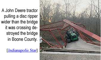 tractorb.jpg A John Deere tractor pulling a disc ripper wider than the bridge it was crossing destroyed the bridge in Boone County (Indianapolis Star)