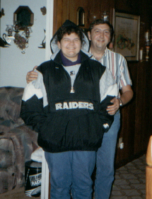 Me and Daddy at my 15th birthday. He got me the Starter jacket!