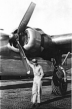 Harvey infront of B-24 Propeller, summer 1944 Italy