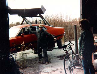 Horseing around a little with this Ford Maverick parts car hanging from the scoop of the John Deere. Roger acts like he is lifting the automobile but it is really the hydraulic system holding the weight, This Maverick Grabber had a 302cid engine, C4 transmission, and an eight inch posi. I haven't ridden my 12-speed racer bicycle since we moved back to the farm from the big city